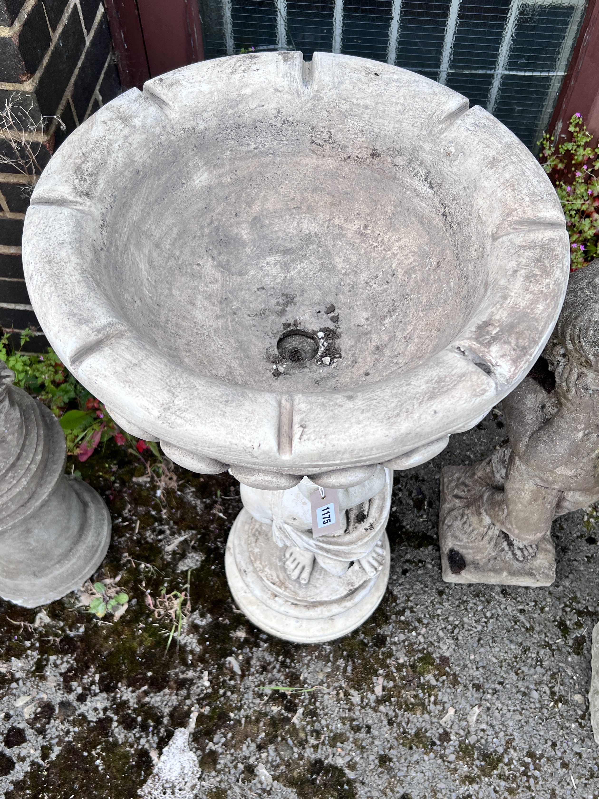 A faux marble cherub garden fountain, height 90cm